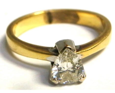 An 18ct gold ring set with a pear shaped diamond, approx weight 3.4g, size L.