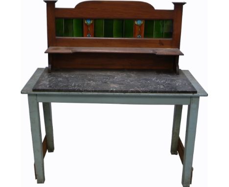The top of an Art Nouveau sideboard, tile back with Art Nouveau stylised decoration, width 107cm and an early 20th century du