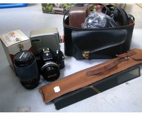 A cased Nikon EM camera with 50mm standard lens, a Cima D8 cine camera, a small kaleidoscope, a Sawyers Viewmaster and a trip