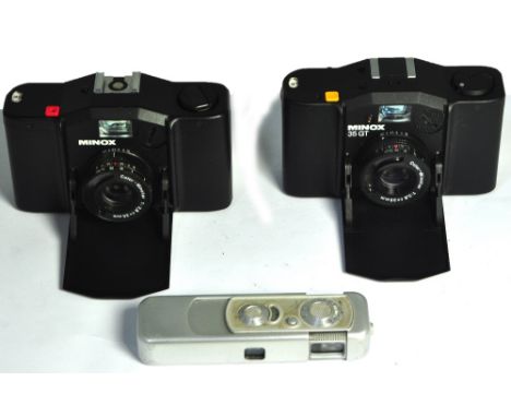A Minox 35GT, 35EL and a Minox sub-miniature spy camera complete with original case and chain (3). CONDITION REPORT All three