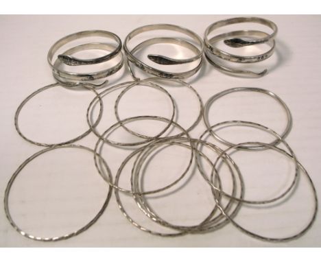 Three Siam white metal snake bracelets and a white metal multi bangle and a hallmarked silver bangle, and a silver dagger pen