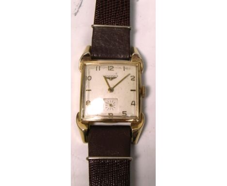 Longines; a 1940s gentlemans tank style dress watch with high grade 17 jewel calibre 23Z manual wind movement, beige satin di