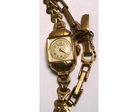Rotary; a 9ct gold ladies wristwatch, dial set with Arabic numerals and gilt markers on a 9ct gold strap.