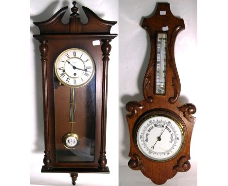 An oak wall hanging barometer, length 80cm and a modern Metamec Vienna style wall clock, length 38cm (2).