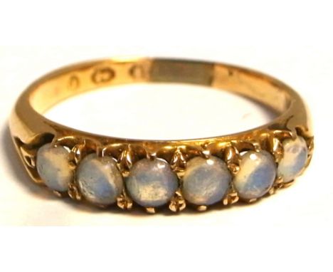 An 18ct gold ring set with a row of six moonstones, size Q, approx weight 3.4g (af). CONDITION REPORT Small section added to 