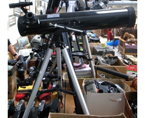 An "Inphase" Newtonian reflecting telescope on tripod.