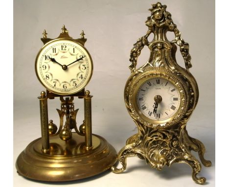 A 20th century German anniversary clock under dome, the white enamel dial set with Arabic numerals, height including dome 29.
