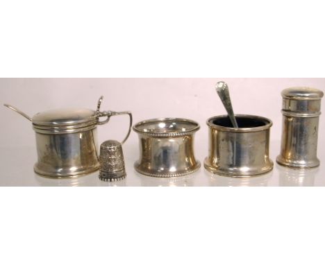 A hallmarked silver salt, mustard, pepper, thimble and napkin ring, various hallmarks (5).