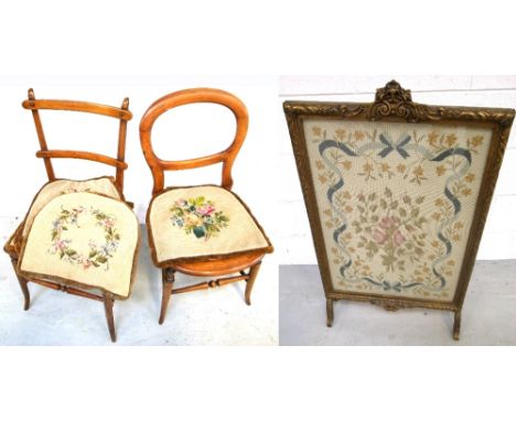 A tapestry fire screen with an overall pattern of floral sprays and ribbons, mounted in a gilded frame, glazed, height 90cm, 
