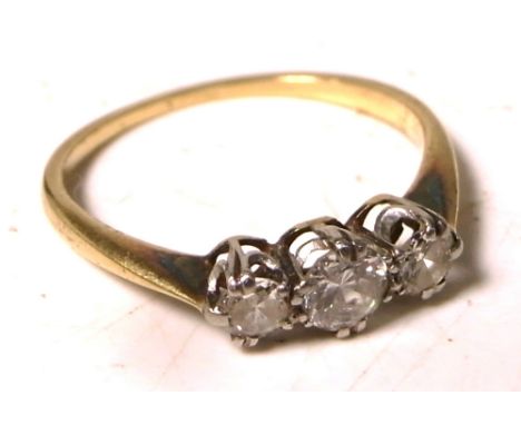 An 18ct gold three stone diamond ring, size K1/2, approx weight 1.8g.