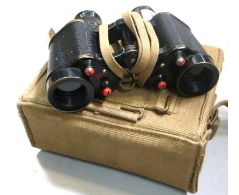 A pair of Taylor Hobson military issue 6x30 binoculars with original carrying case, strap and lanyard.  CONDITION REPORT  Bin