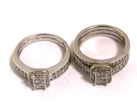 A 9ct white gold and diamond set three band ring with central raised rectangular platform and further diamonds to the shoulde