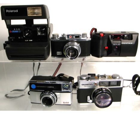 A small quantity of still cameras to include an Olympus 35ED compact range finder camera, a Pentax auto focus compact camera 