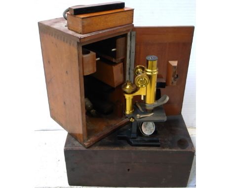 A cased early 20th century Carl Zeiss Jena brass monocular microscope with various Zeiss eye piece lenses and one by Leitz, m