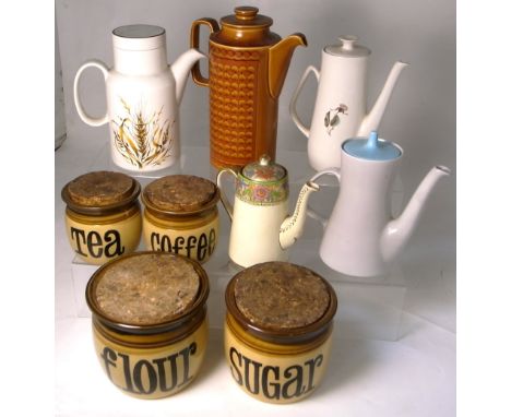 Four brown glazed storage jars by T.G. Green and five assorted coffee pots by Hornsea, Poole etc (9).