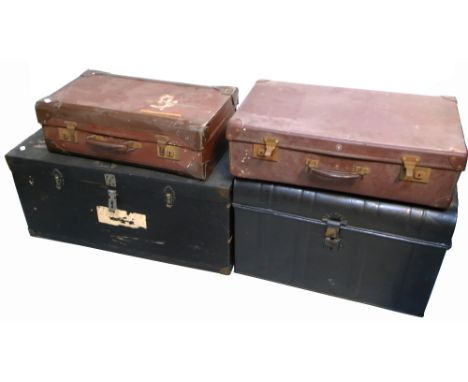 A brass bound wooden travelling trunk of rectangular form bearing the remnants of railway labels, a further metal travelling 