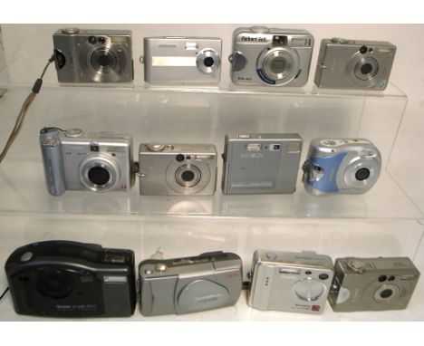 Twelve assorted compact digital cameras to include three Canon Ixus and examples from Olympus, Kodak and Fuji (12). CONDITION