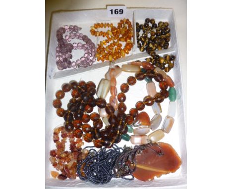 Assorted vintage beaded necklaces, including amber, tiger's-eye etc