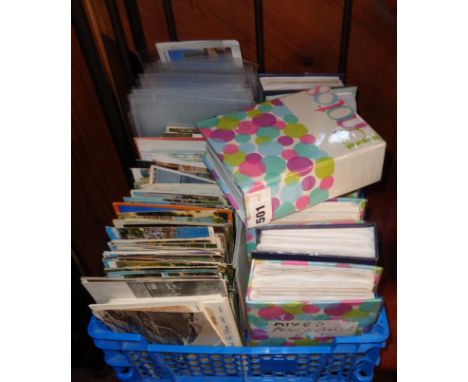 Box of vintage postcards, some in albums