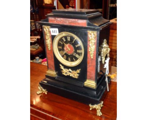 Victorian marble mantle clock by Maple &amp; Co with ormolu mounts and black dial and gilt Roman numerals, the movement strik