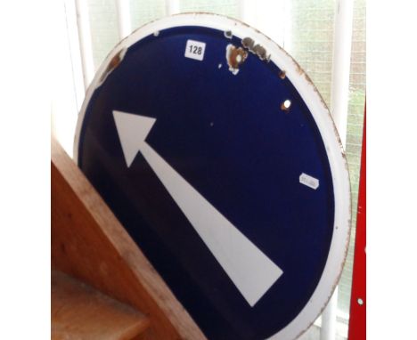 Round enamel traffic sign with white arrow on blue background