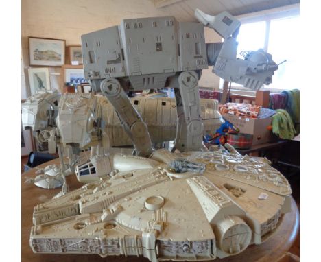 Five various vintage Star Wars models of spacecraft and robots, including 'The Millennium Falcon' and large AT-AT Walker
