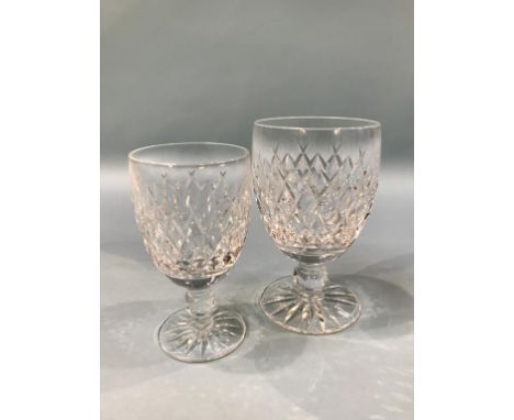 A collection of Waterford crystal glass, comprising twelve small wine glasses, twelve large wine glasses and four sherry glas