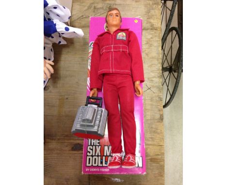 An original 1970s boxed Six Million Dollar Man action doll with engine block in working condition.