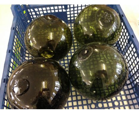4 vintage glass fishing boat floats/bouys. All hand blown with pontil marks, one is marked with a shamrock / clover.