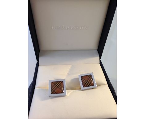 A boxed pair of designer Burberry cufflinks.
