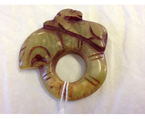An oriental jade carving of a tiger on a serpents back, believed to be late 19th / early 20th century.