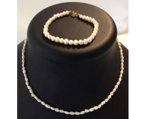 A freshwater pearl necklace and a pearl bracelet.