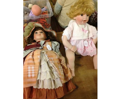 Large bisque porcelain head & limb baby doll, together with a large dressed bisque doll.