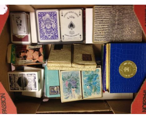 A box of assorted vintage playing cards to include Waddingtons.