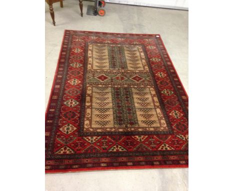 A vintage red & cream patterned wool rug /carpet. Approx 200 x 140cm - no fringing.