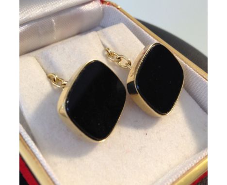 A 14ct gold pair of Onyx cufflinks.