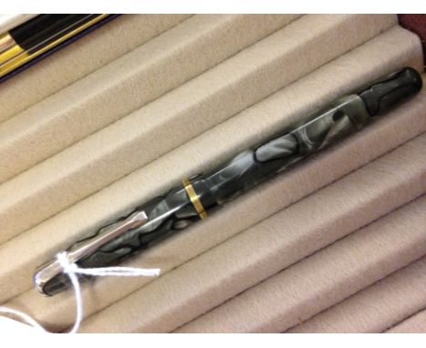 A Burnham 'B48' fountain pen c1953. Light/dark grey marble with black veins. Burnham logo on clip, clear barrel imprint. Trim