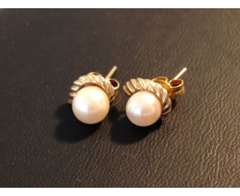 A pair of 9ct gold & pearl earrings.