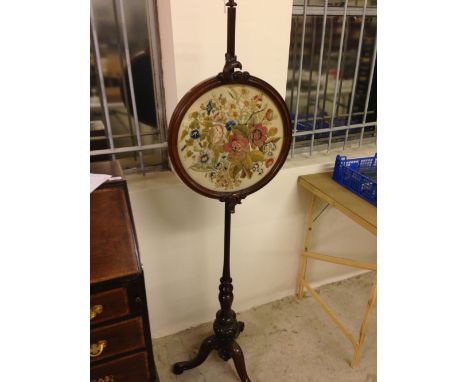 A Victorian pedestal face/fire screen with intricate hand embroidered circular panel in excellent condition.