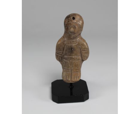 A fine Manteno figure from Ecuador, ca. 1000 - 1500 AD. This standing female is posed with arms held to her sides. Clothing i