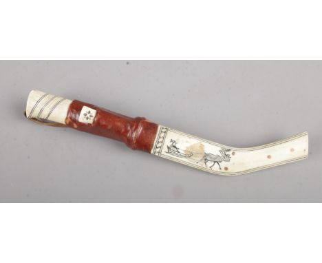 An Inuit bone hunting knife. 26cm length  