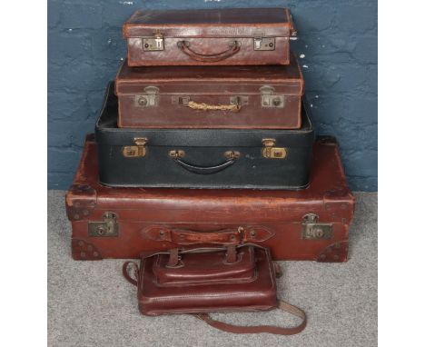 Four vintage leather suitcases along with a similar satchel.  