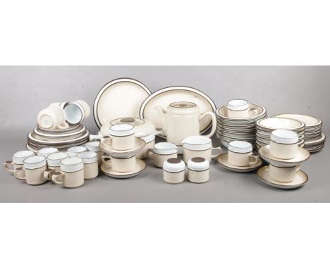 A quantity of cream Denby tea &amp; dinnerwares. tea cups/saucers, coffee cups, teapot, dinner plates, dishes, milk jug, suga