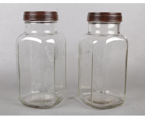 Two vintage glass 'Holland Toffee' jars with Bakelite screw lids. Has 'Best on Earth' pressed into jars. H: 32cm, W: 15cm.  C