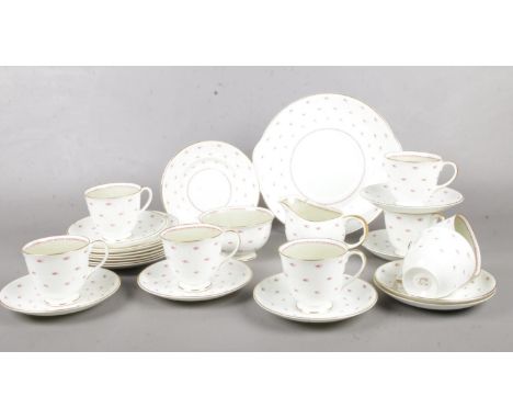 A Susie Cooper part tea set. cups/saucers, milk jug, sugar bowl, side plates etc  crack in sugar bowl