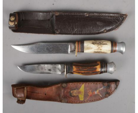Two small sheathed hunting knives. Includes R Cooper and Atlanta.  