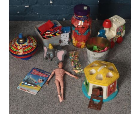 A box of vintage toys. Including Lego, Action Man figure, Thunderbirds toy in original packaging, Tin spinning top, etc.  