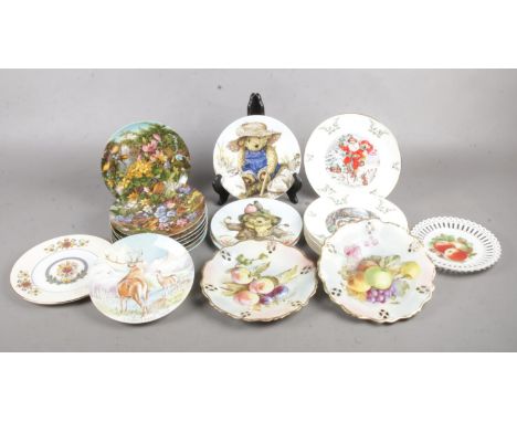 A box of twenty one collectors plates. To include, Royal Worcester World of Bears, Crown Staffordshire Monarch of the Glen &a
