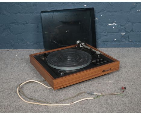 A Garrard 86sb vintage turntable.  Condition fair. Not able to test if working as has no plugs.