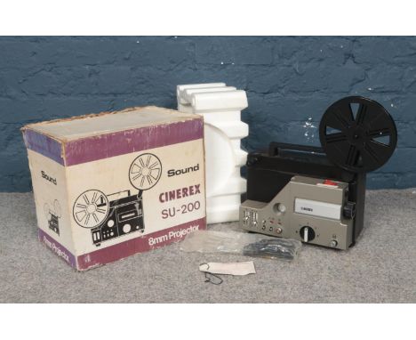 A boxed Cinerex SU-200 8mm Projector with microphone.  Condition untested. No power cables come with this projector.